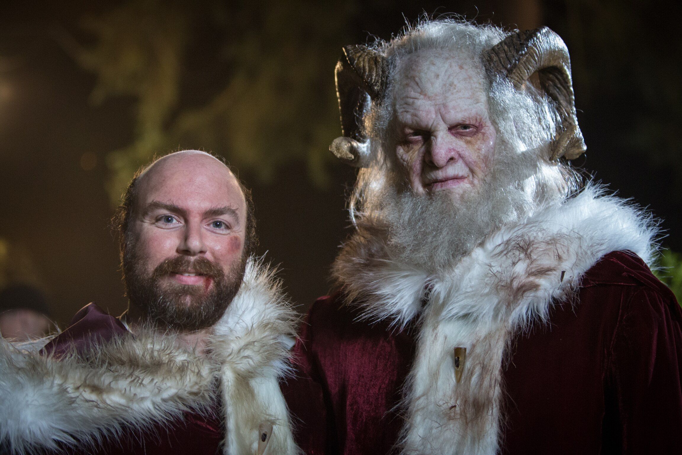 Krampus and a guy dressed as Santa Clause 