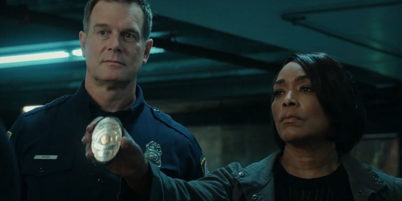 Bobby Nash (Peter Krause) stands by Athena Grant (Angela Bassett) as she shows off her police badge in 9-1-1 Season 8 Episode 3