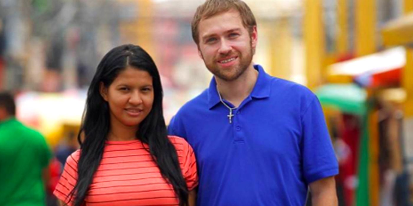 Paul and Karine stand next to each other and pose for a photo in 90 Day Fiance.