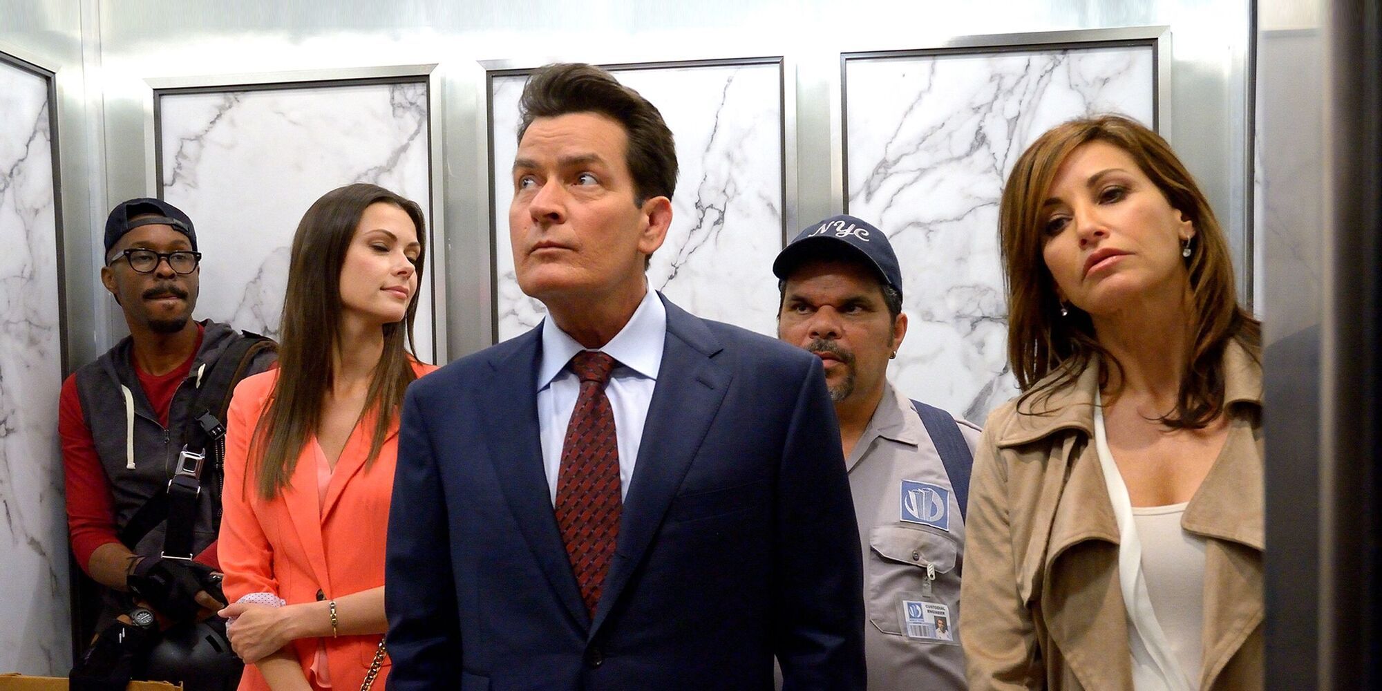 A group of five people, including Charlie Sheen as Jeffrey Cage, standing together in an elevator at the World Trade Center in &lsquo;9/11&rsquo; (2017)