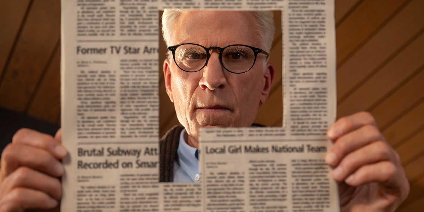 Ted Danson looking through a cut out in a newspaper in A Man on the Inside