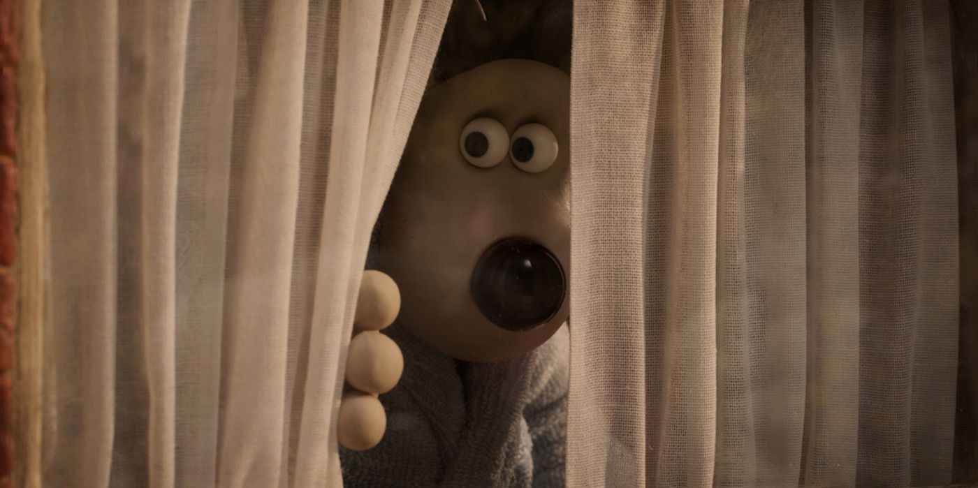 Gromit looking out a window in Wallace &amp; Gromit: Vengeance Most Fowl