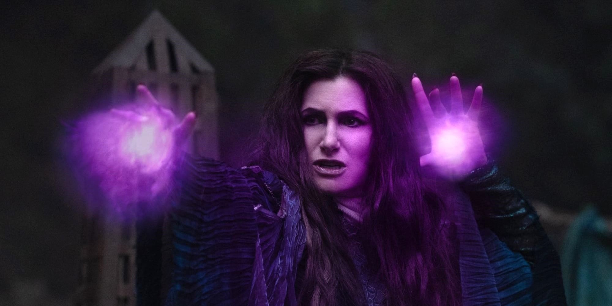 Kathryn Hahn as Agatha gestures with purple light emanating from her hands in Agatha All Along.