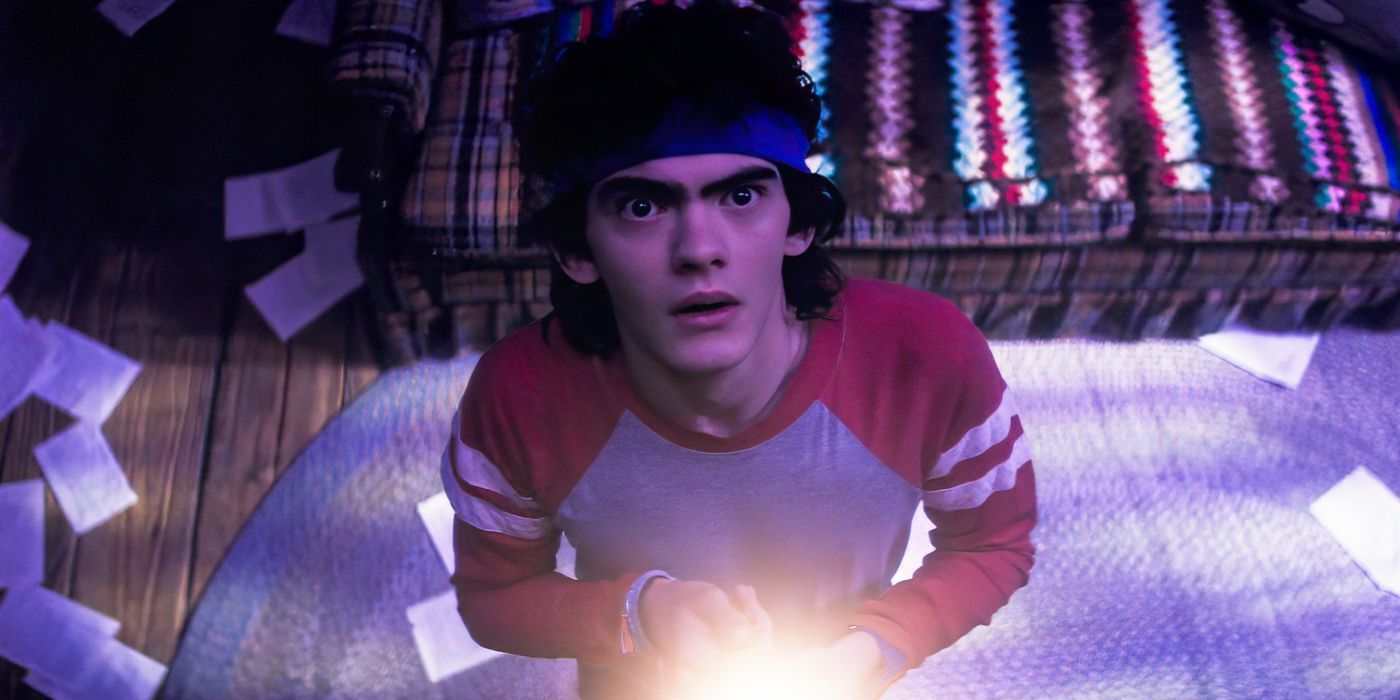 Joe Locke as Teen in Agatha All Along, dressed in 80s workout gear and holding a light
