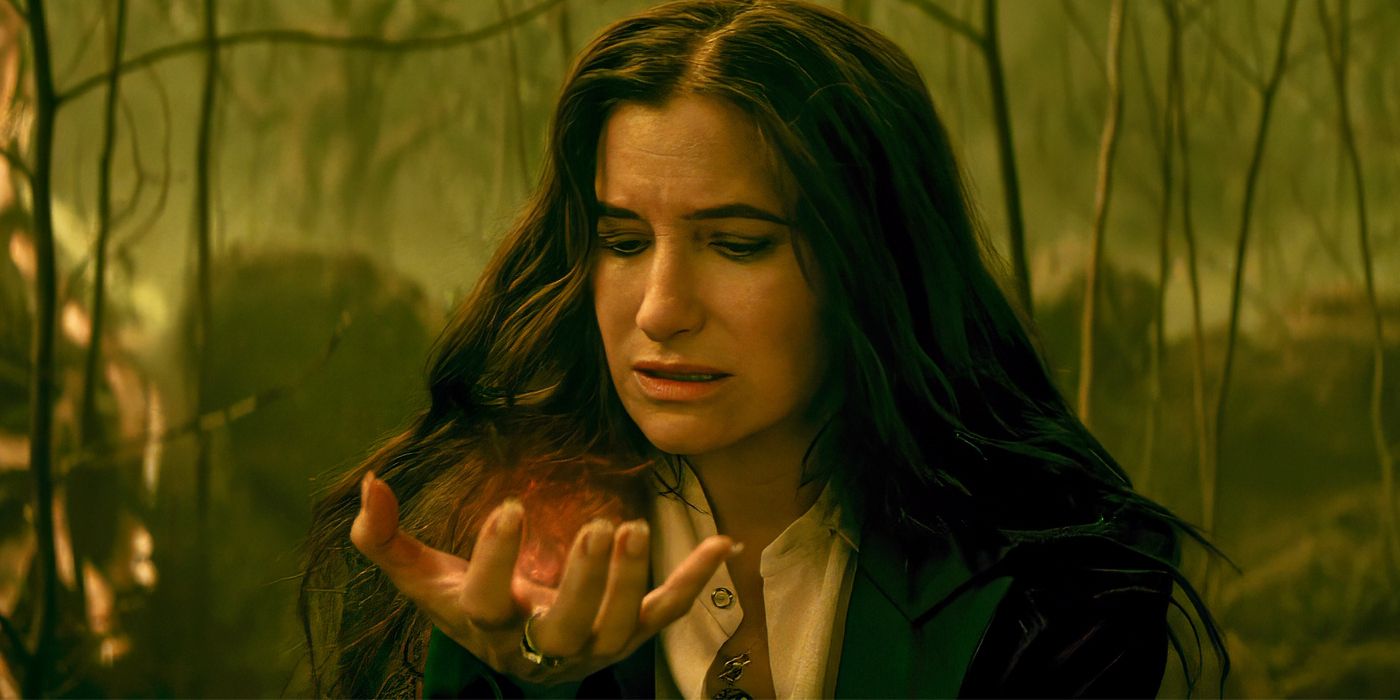 Kathryn Hahn looking down at her hand as Agatha Harkness in Agatha All Along