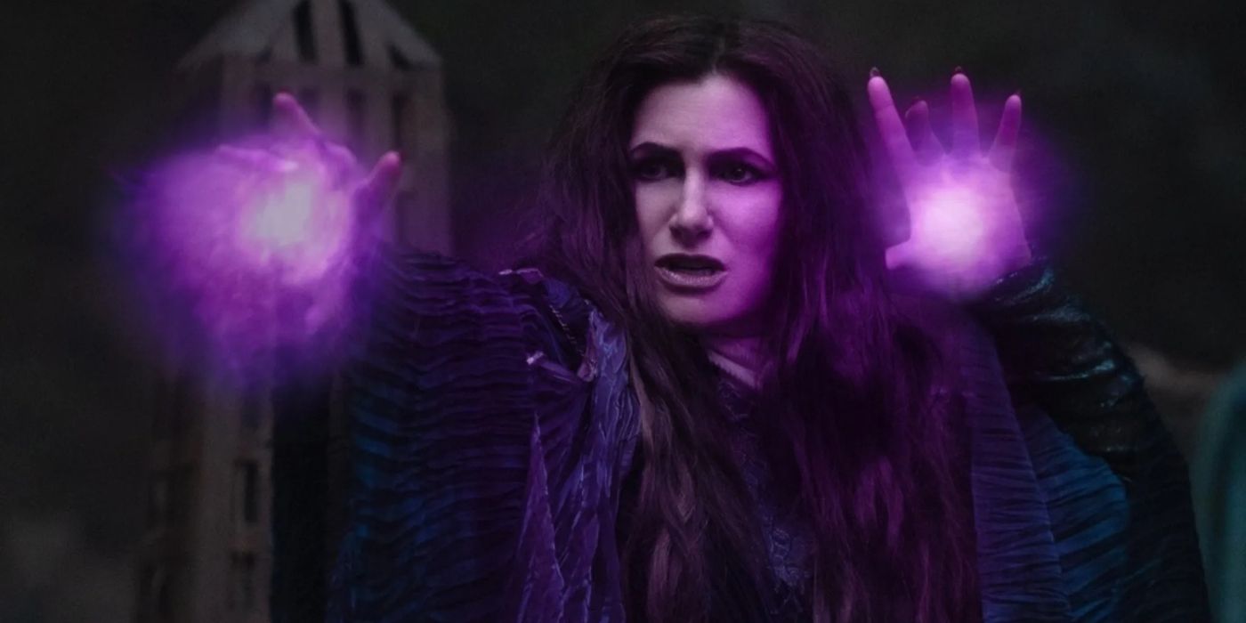 Agatha Harkness with her hands up, they have purple orbs in them resembling her witch powers.