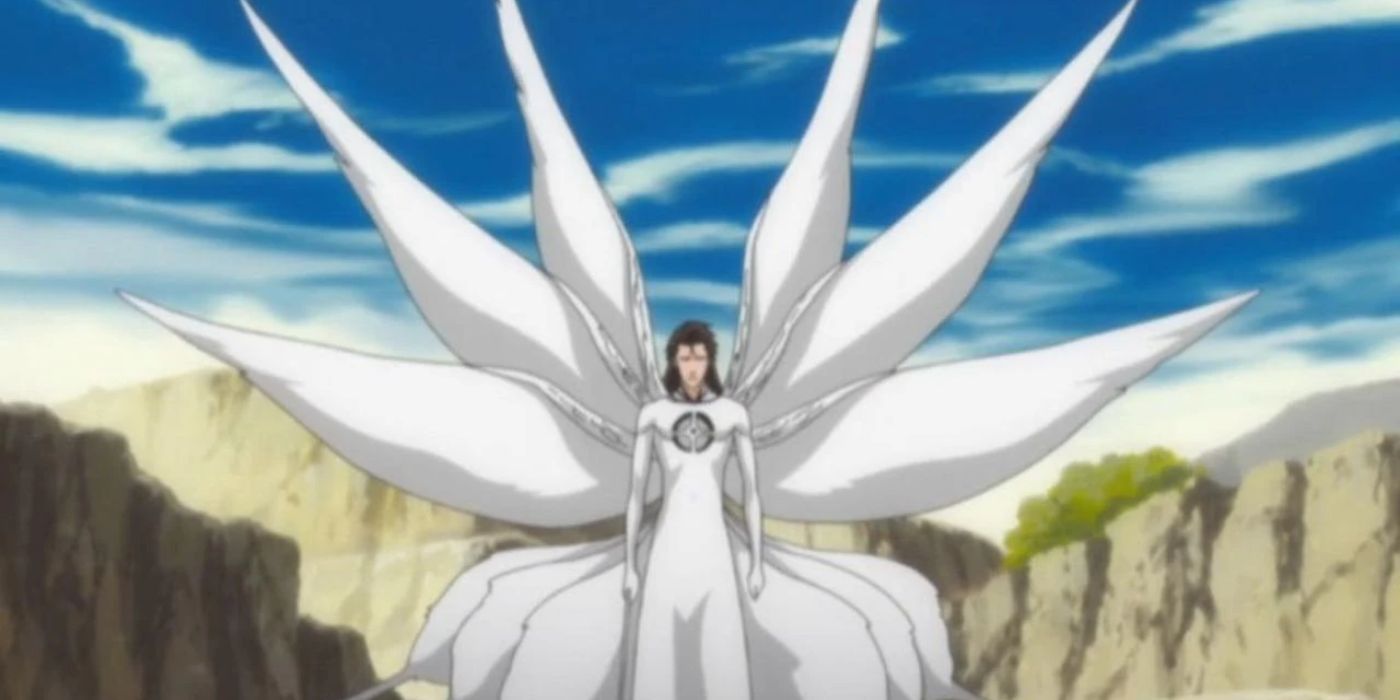 Aizen with multiple wings and hole in his chest in Bleach