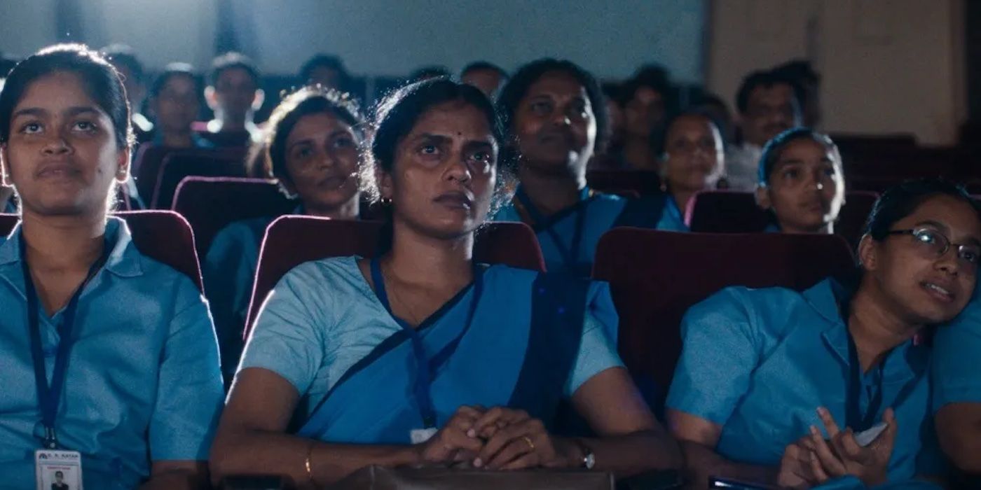 ?Kani Kusruti watching a movie in the cinema as Prabha in All We Imagine as Light.