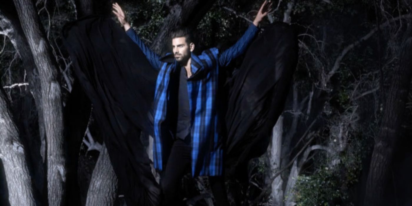 Nyle DiMarco poses in the woods on 'America's Next Top Model.'