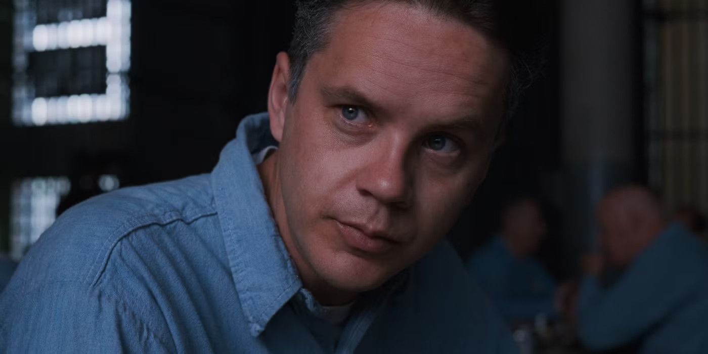 Andy looking intently at someone on his right in The Shawshank Redemption