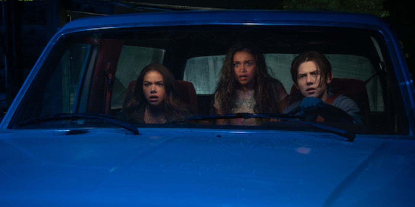 Antonia Gentry, Madison Bailey, and Griffin Gluck inside a blue car with shocked expressions in 'Time Cut'.