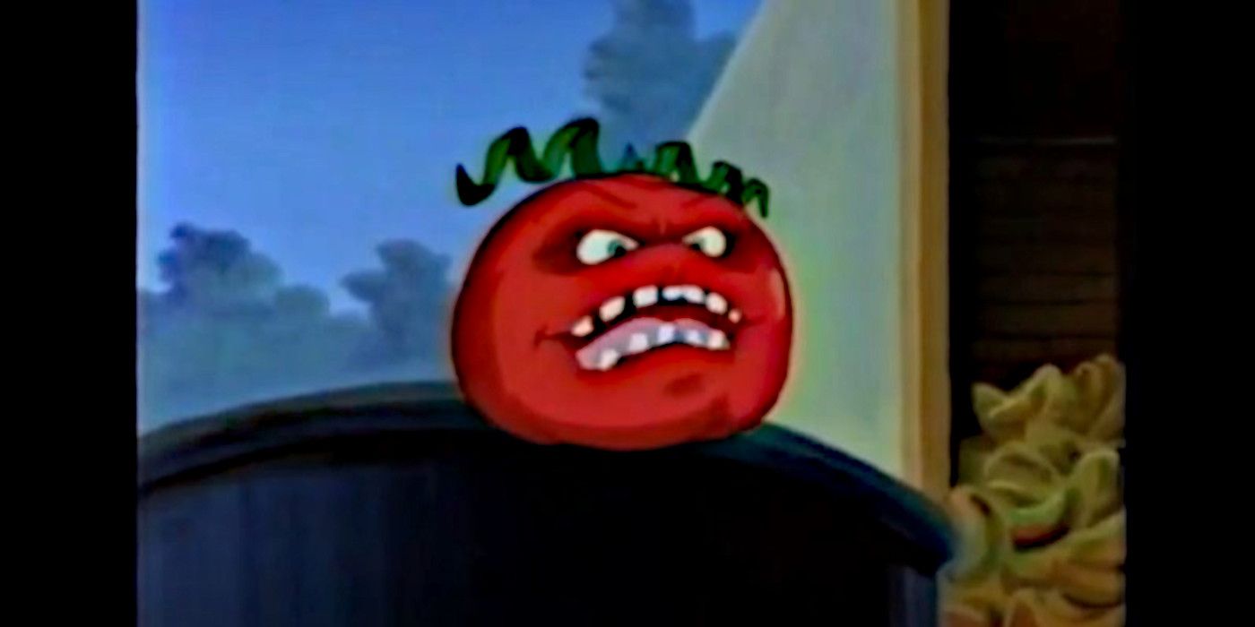 A mutated tomato with eyes and a mouth sits atop a trash can in 'Attack of the Killer Tomatoes.'