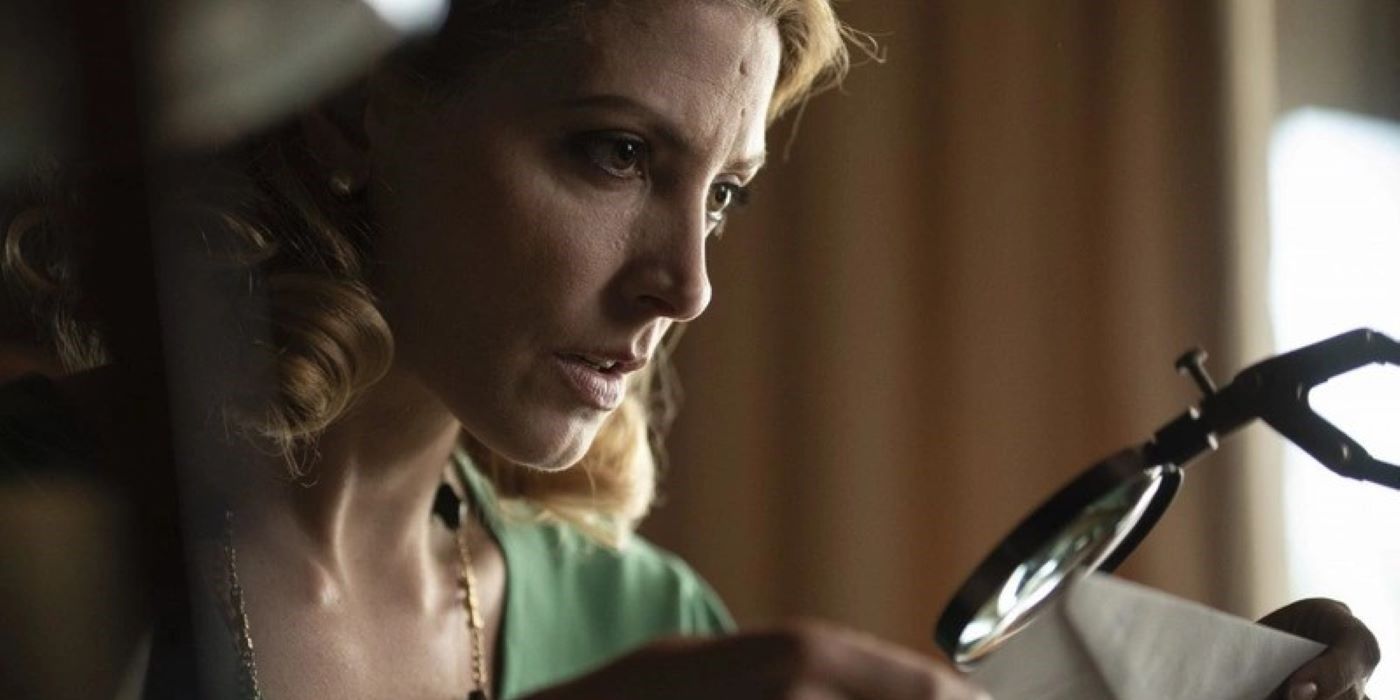 Barbara Lennie looking through a magnifying glass in God&rsquo;s Crooked Lines