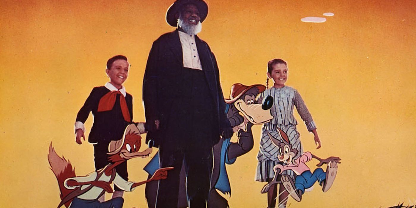 Bobby Driscoll, James Baskett, and Luana Patten with the animated characters of 'Song of the South'