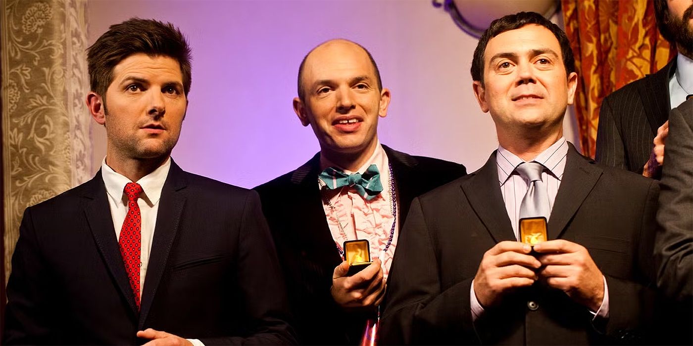 Adam Scott, Paul Scheer, and Joe Lo Truglio standing together in Burning Love