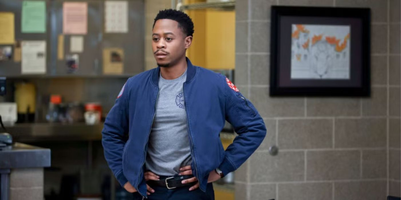 Firefighter Darren Ritter (Daniel Kyri) stands confidently in the station, hands on hips