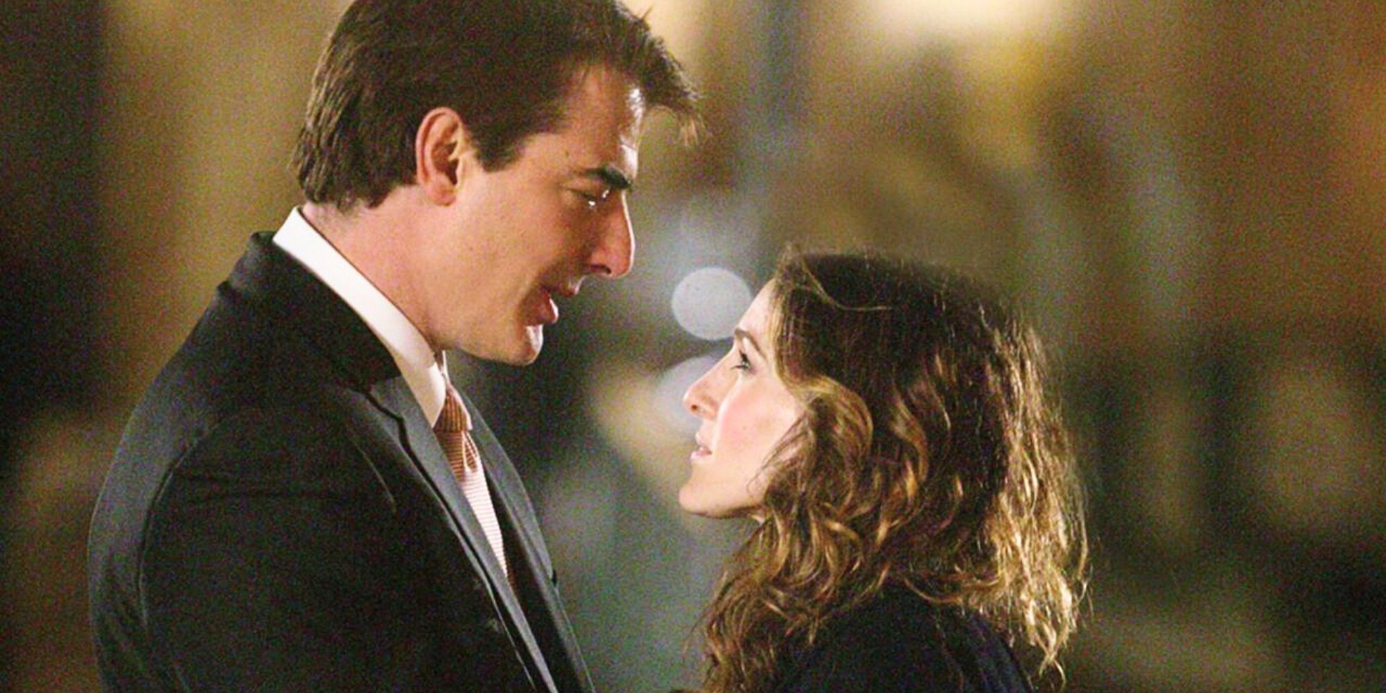 Christopher Noth and Sarah Jessica Parker standing in front of each other in Sex and the City