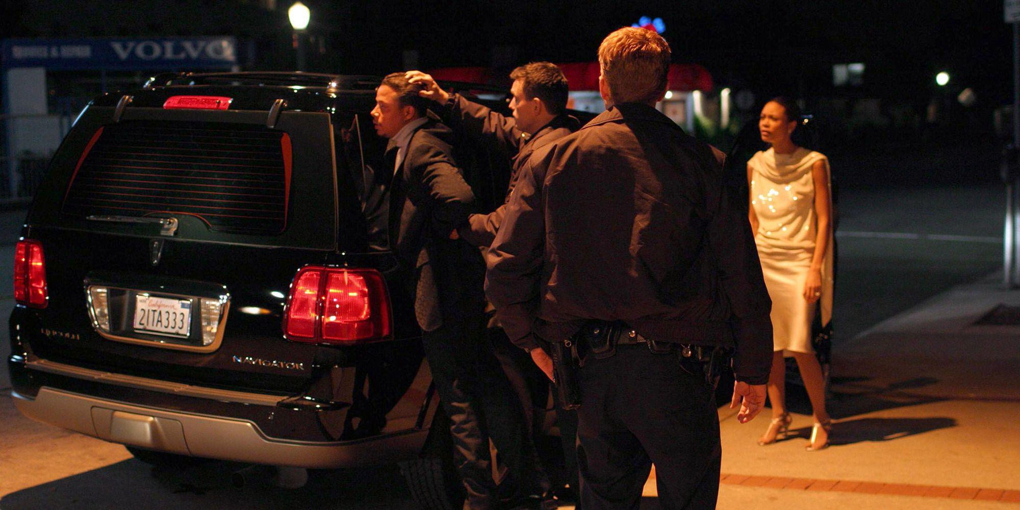 Cops arresting a man outside his car on a dark night in &lsquo;Crash&rsquo; (2004)