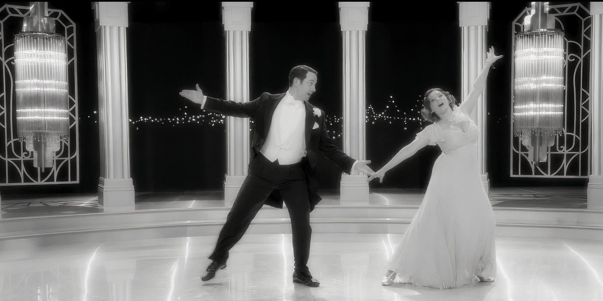 Greg and Rebecca dance in formal 1950s attire in black-and-white in Crazy Ex-Girlfriend.