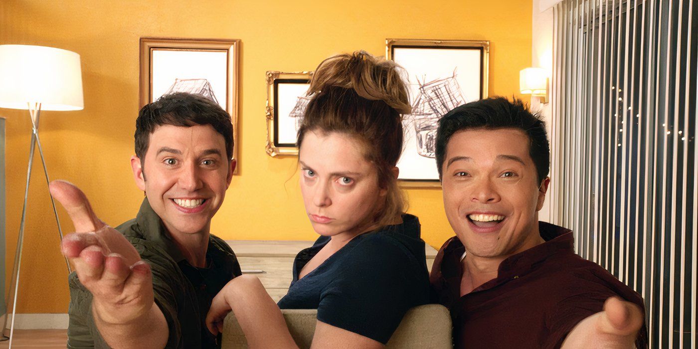Greg and Josh smile as they sing, with Rebecca scowling in between them in Crazy Ex-Girlfriend.