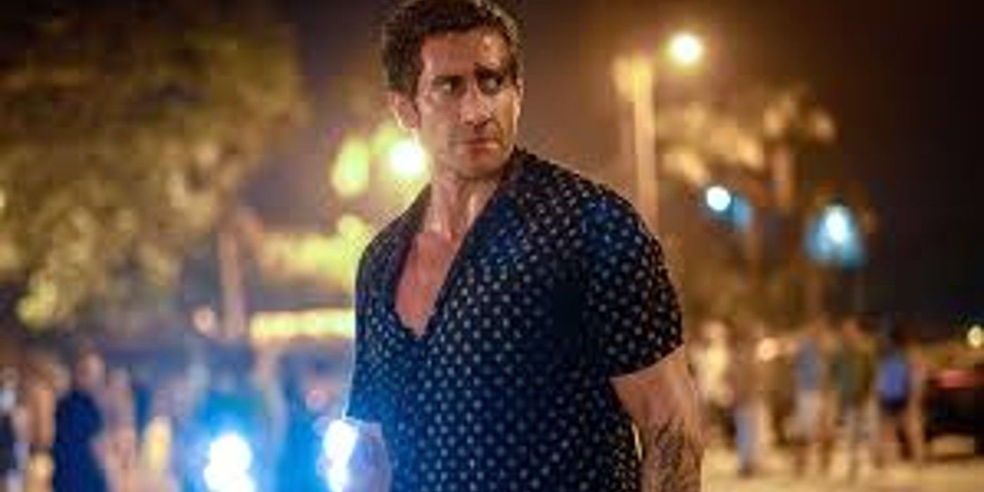 Dalton with blood on his face standing on the street in Road House