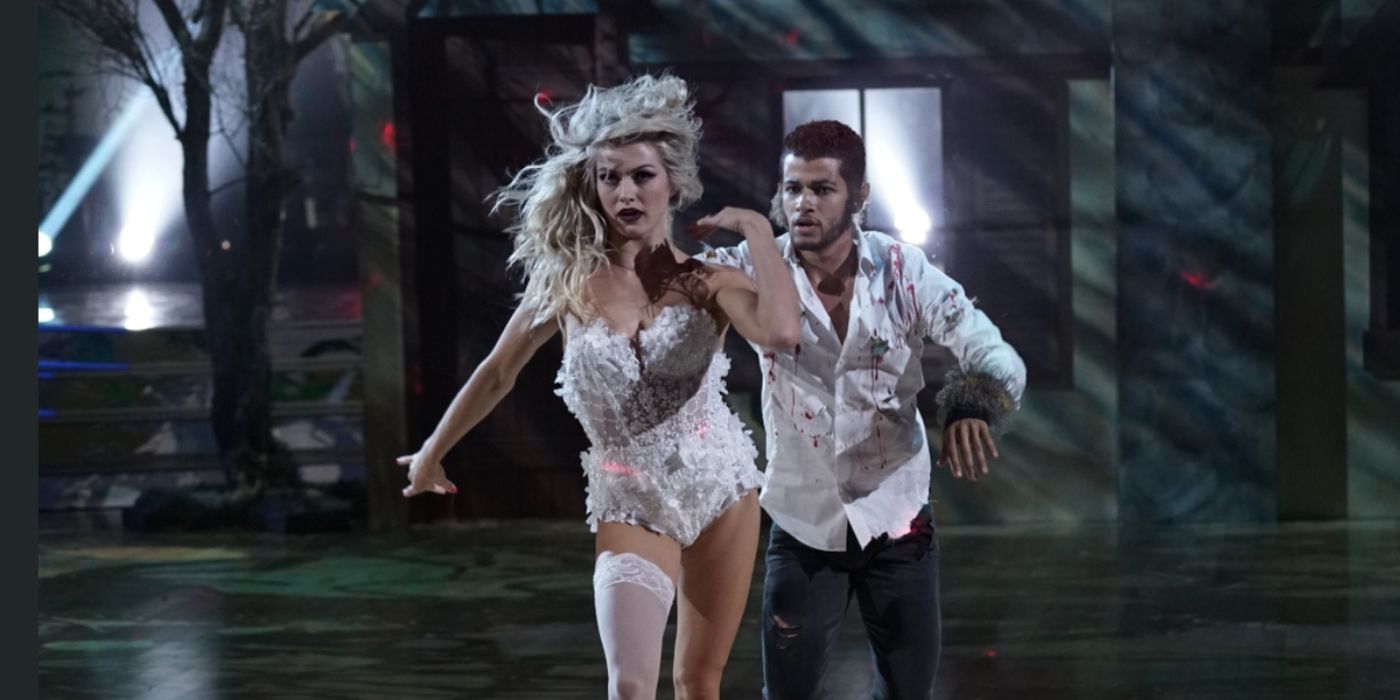 Jordan Fisher and Lindsay Arnold in Halloween costumes dancing together on Dancing with the Stars.