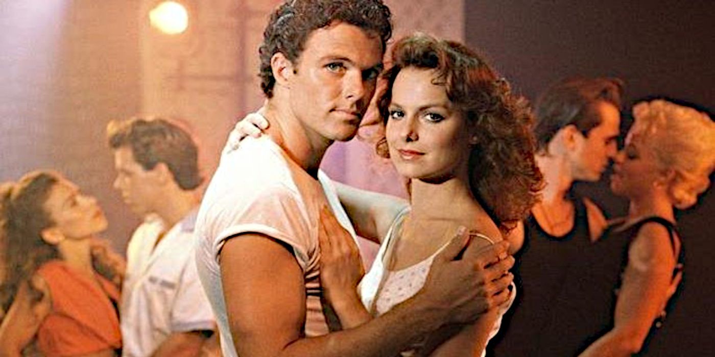 Baby and Johnny have their arms around one another mid-dance on the television series Dirty Dancing.