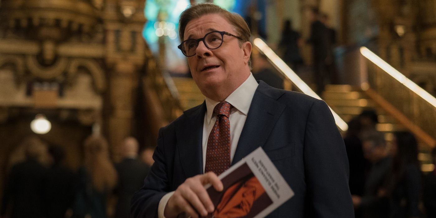 Nathan Lane holding an opera program in the Elsbeth Season 2 premiere
