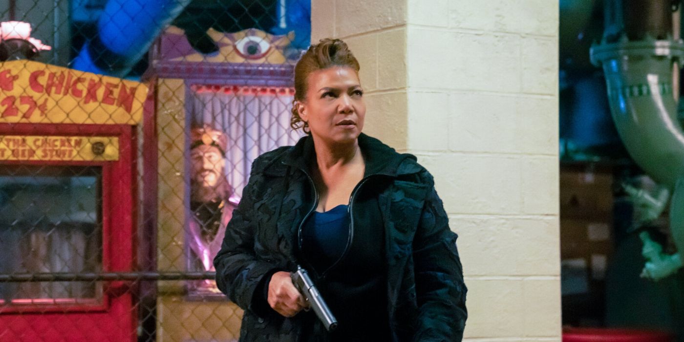 Queen Latifah walks around with her gun drawn in 'The Equalizer.'