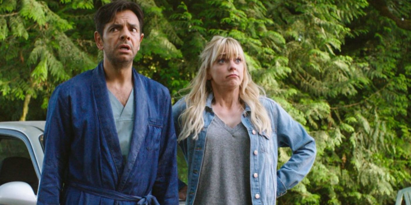 Eugenio Derbez wearing a house robe and Anna Faris in a denim shirt are looking surprisedin a scene from the movie 'Overboard'