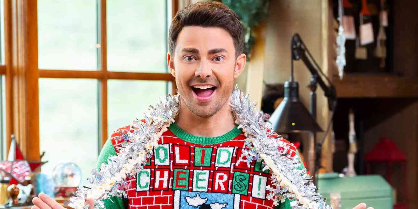Jonathan Bennett in a Christmas sweater in a promo photo for &lsquo;Finding Mr. Christmas.'
