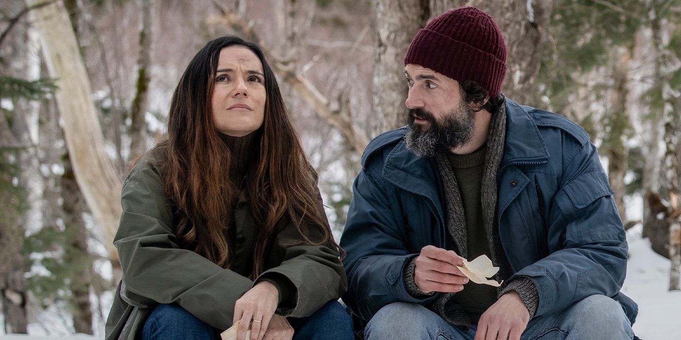 Catalina Sandino Moreno as Tabitha and David Alpay as Jade sitting outside in the snow together in 'From'