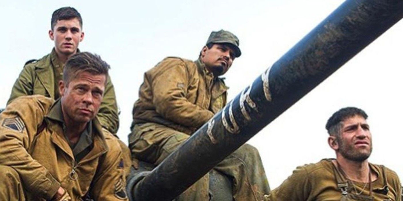 Brad Pitt, Jon Bernthal, Michael Pena, and Logan Lerman sitting on their tank in Fury