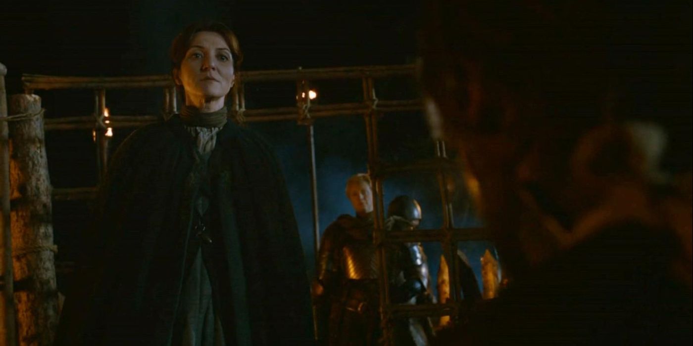 Catelyn Stark and Brienne of Tarth confront Jaime Lannister as he sits in his cell at night in 'Game of Thrones' Season 2, Episode 7 "A Man Without Honor".