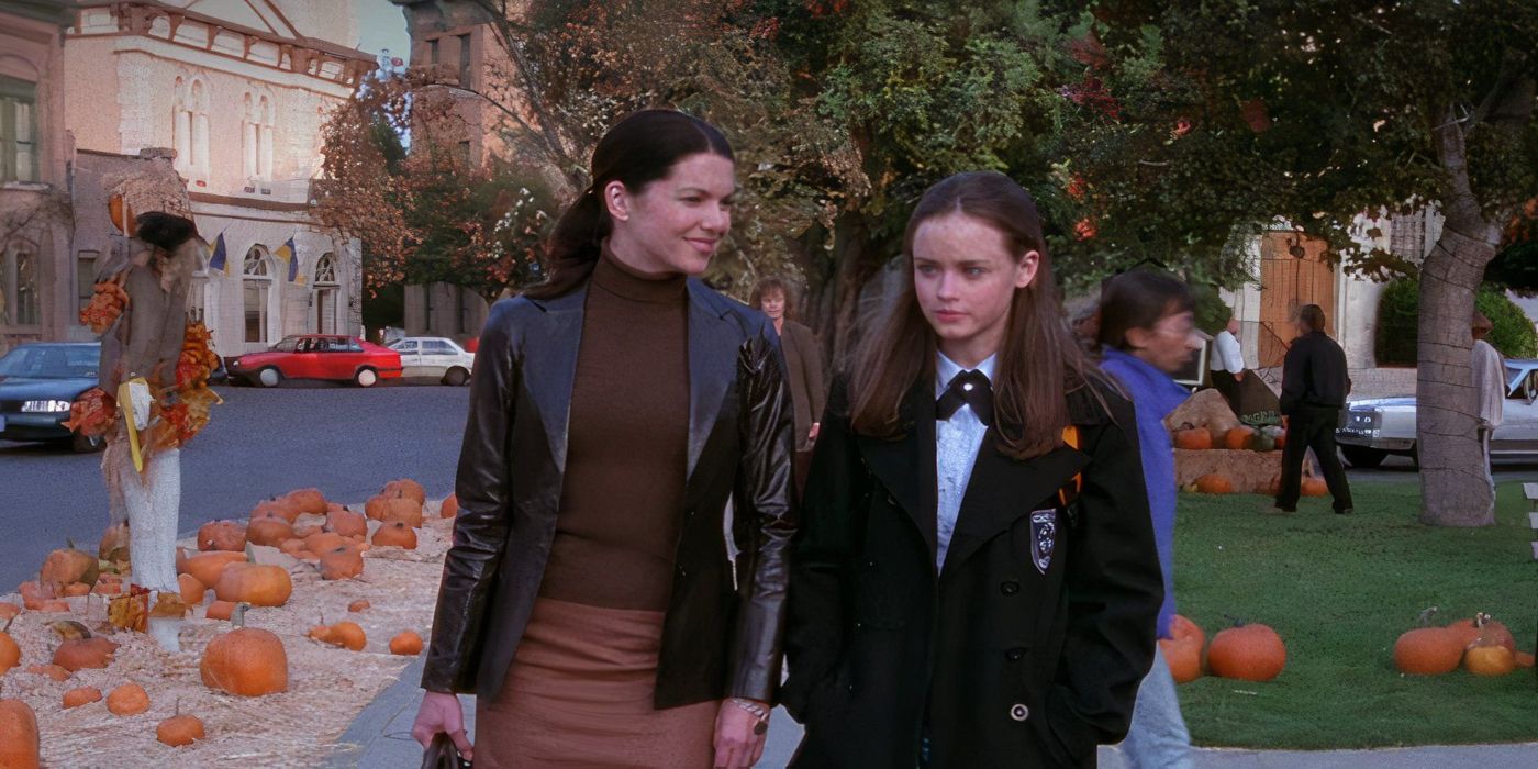 Lorelai and Rory walking through Stars Hollow during fall in Gilmore Girls. 