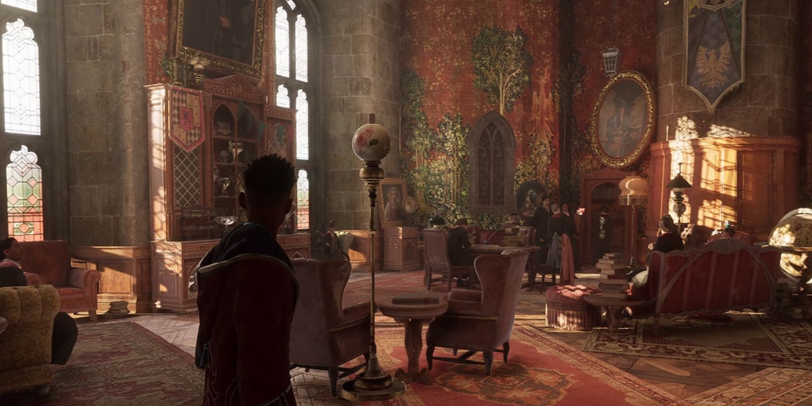 A student in the Gryffindor Common Room in Hogwarts Legacy
