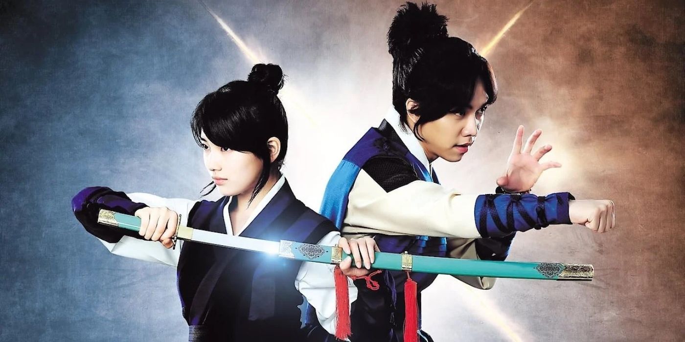 Two of the cast from Gu Family Book pose for a promotional photo with a long sword and action stance.