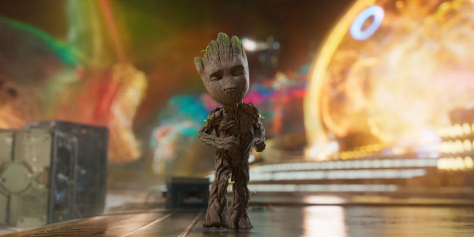 Baby Groot dances while a battle unfurls behind him in?'Guardians of the Galaxy Vol. 2'???????.