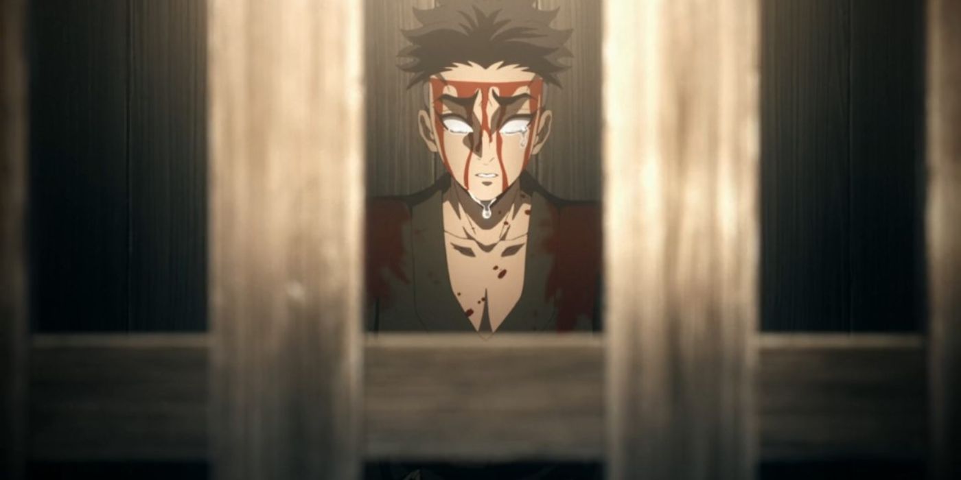 Gyomei, drenched in blood, crying in a prison cell in Demon Slayer.