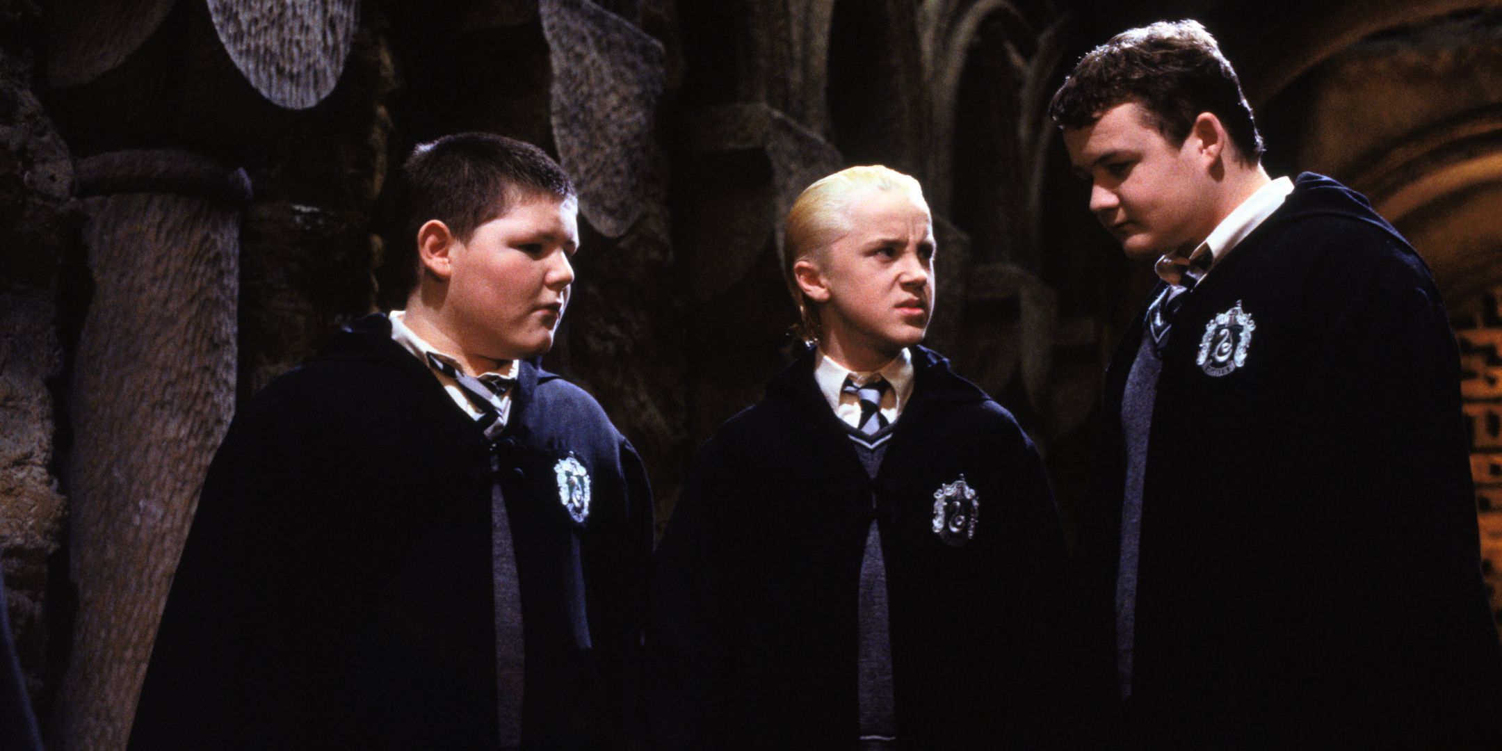 Jamie Waylett como Crabbe, Tom Felton como Draco Malfoy y Josh Herdman como Goyle en Harry Potter y la cámara secreta.