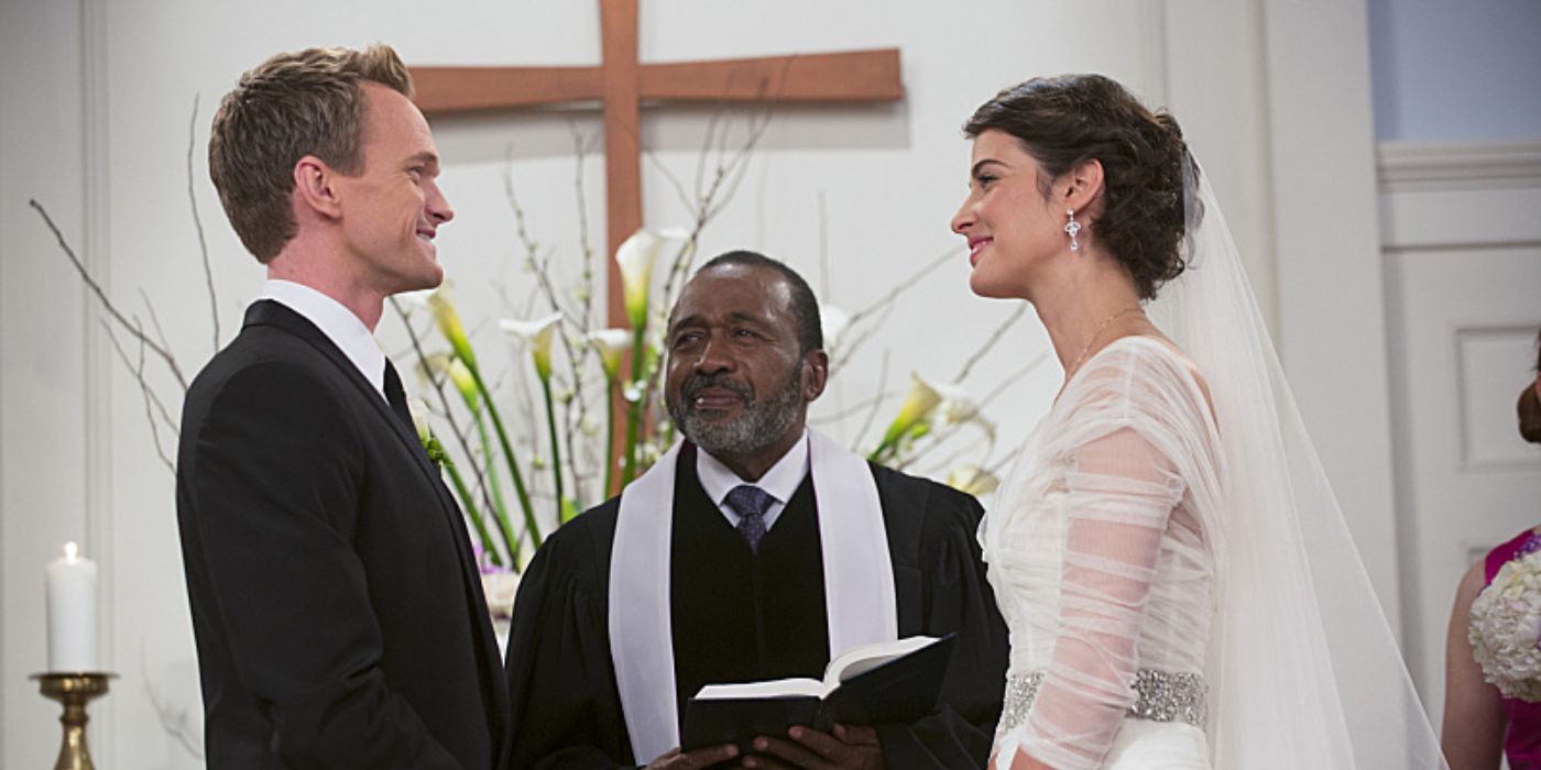 Barney and Robin stand facing each other at the altar, smiling at one another as they prepare to get married in 'How I Met Your Mother' Season 9, Episode 22 "The End of the Aisle"