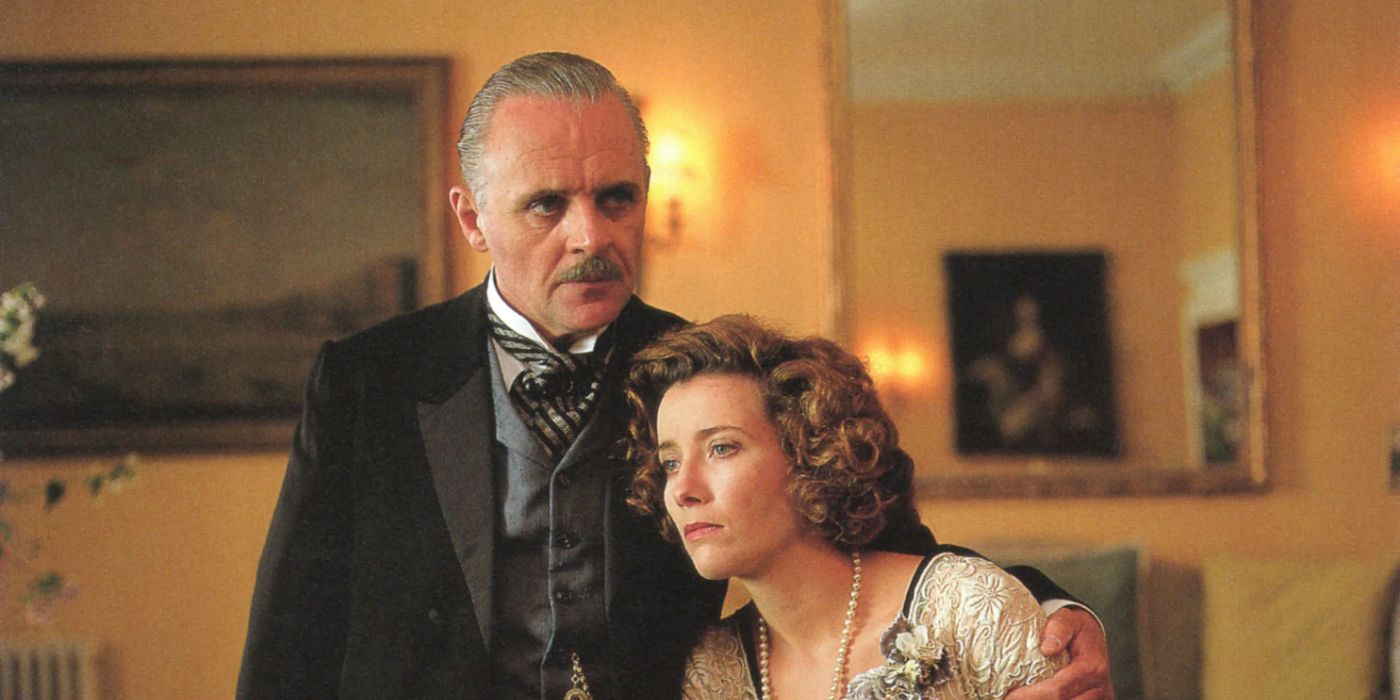 Henry Wilcox (Anthony Hopkins) has his arm around Margaret (Emma Thompson) looking somber in Howards End.