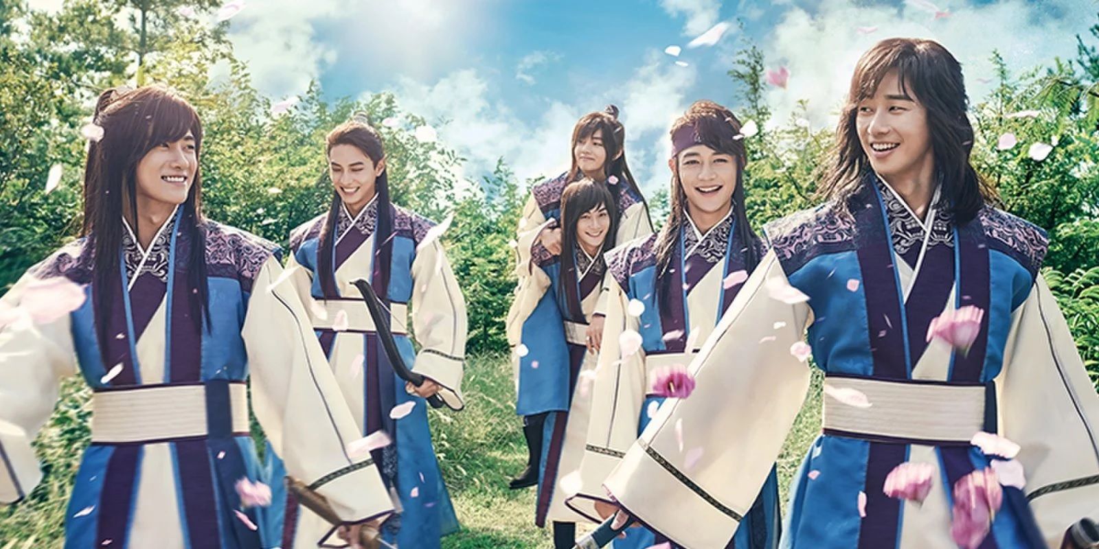 The cast smile as they wear traditional clothing and walk among bushes in Hwarang The Poet Warrior Youth.