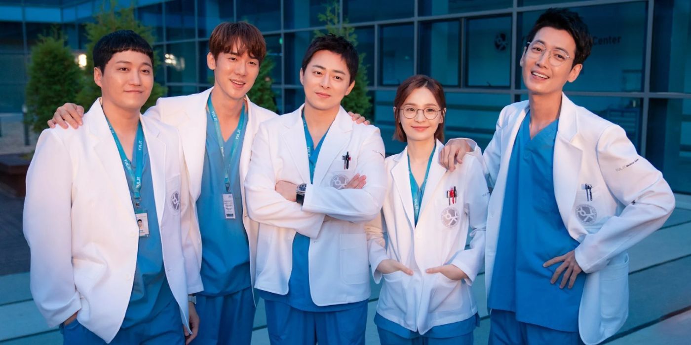 The Hospital Playlist cast is looking forward and smiling side by side. 