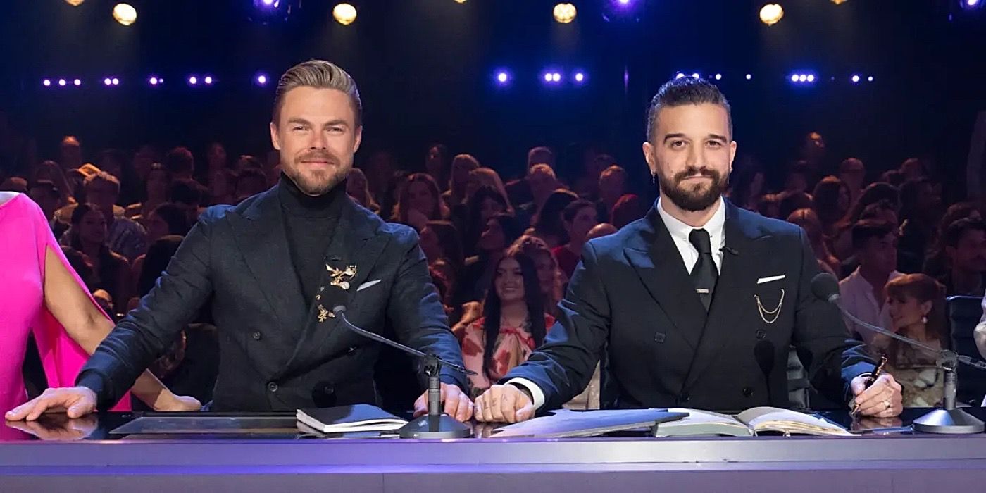 Mark Ballas and Derek Hough sitting at the judges table on Dancing with the Stars