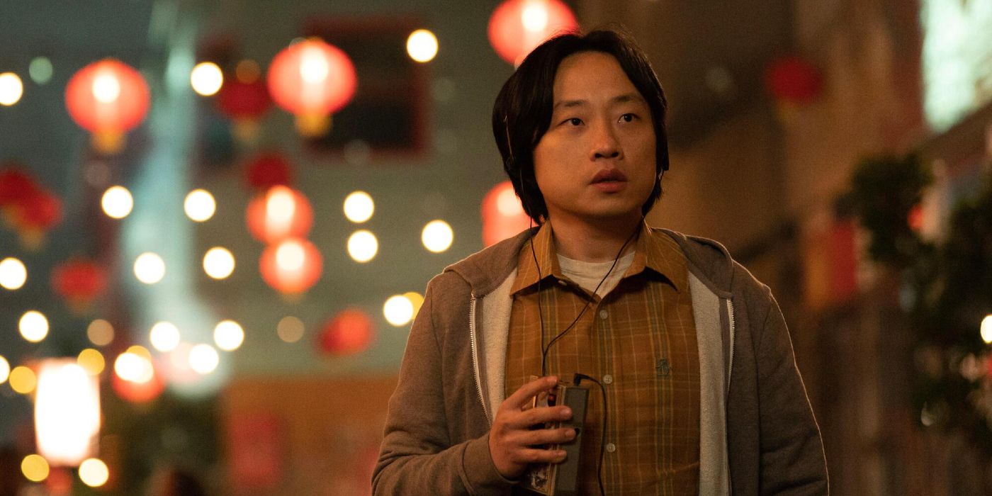 Jimmy O. Yang walking through Chinatown with a Walkman in Interior Chinatown