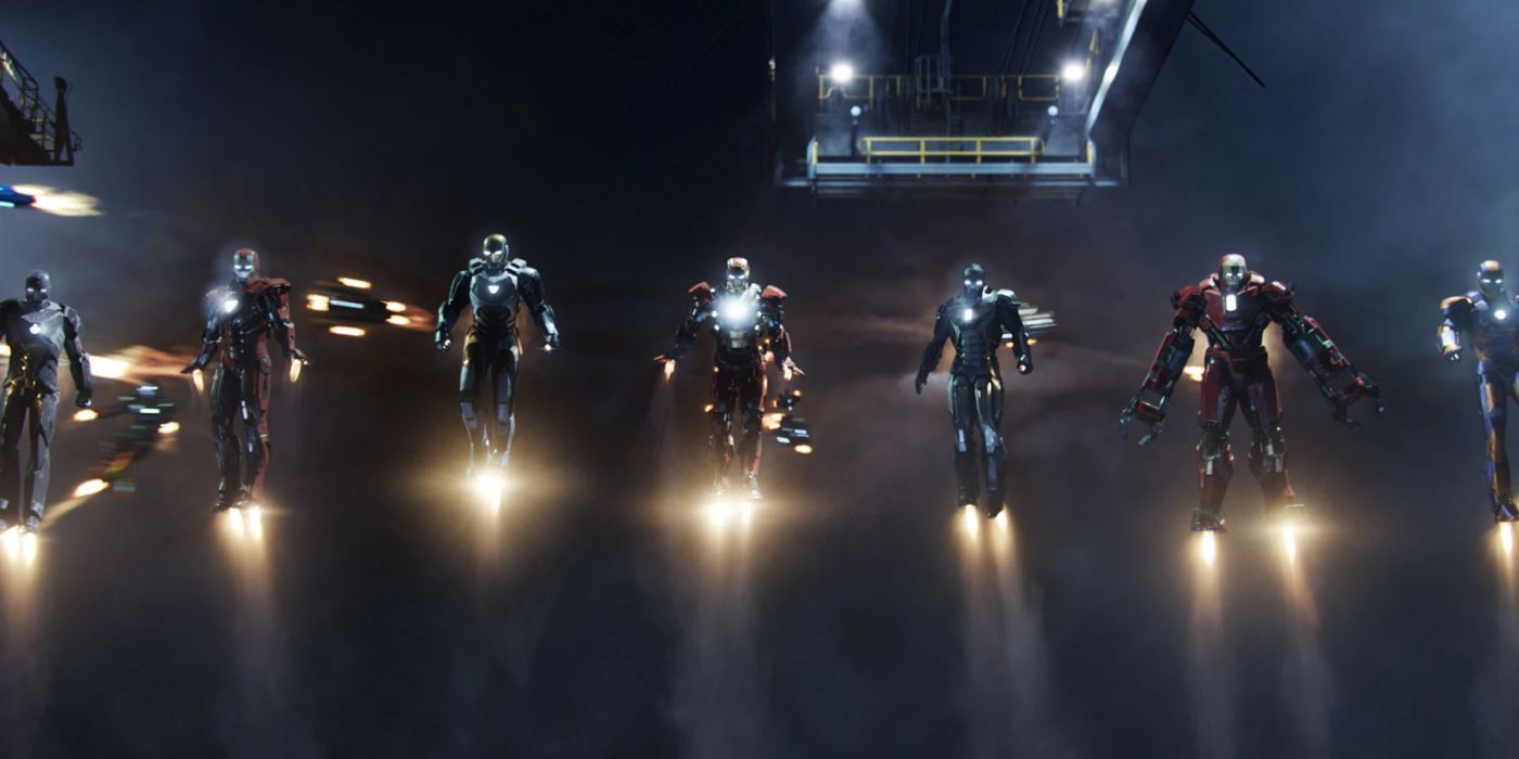 A row of Iron Man suits of different varieties in midair as the house party protocol in Iron Man 3.