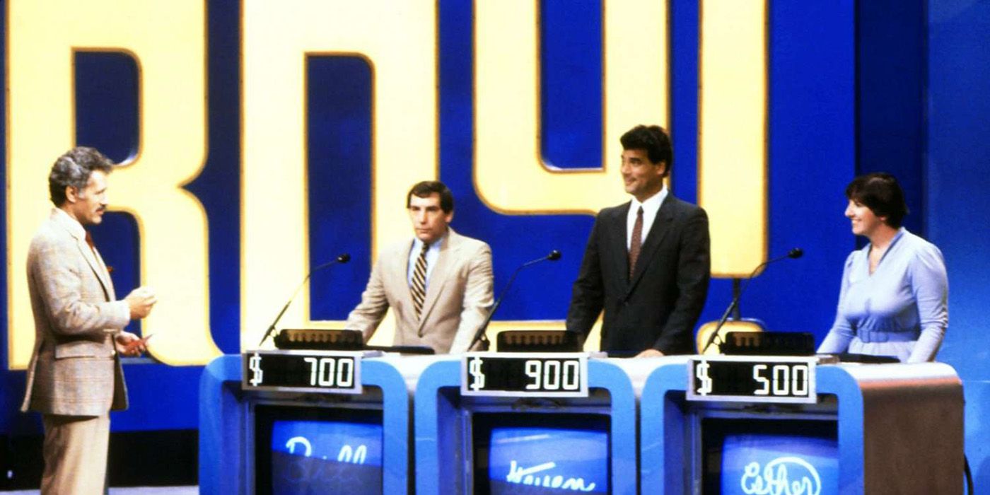 Alex Trebek talking to the three contestants on Jeopardy!