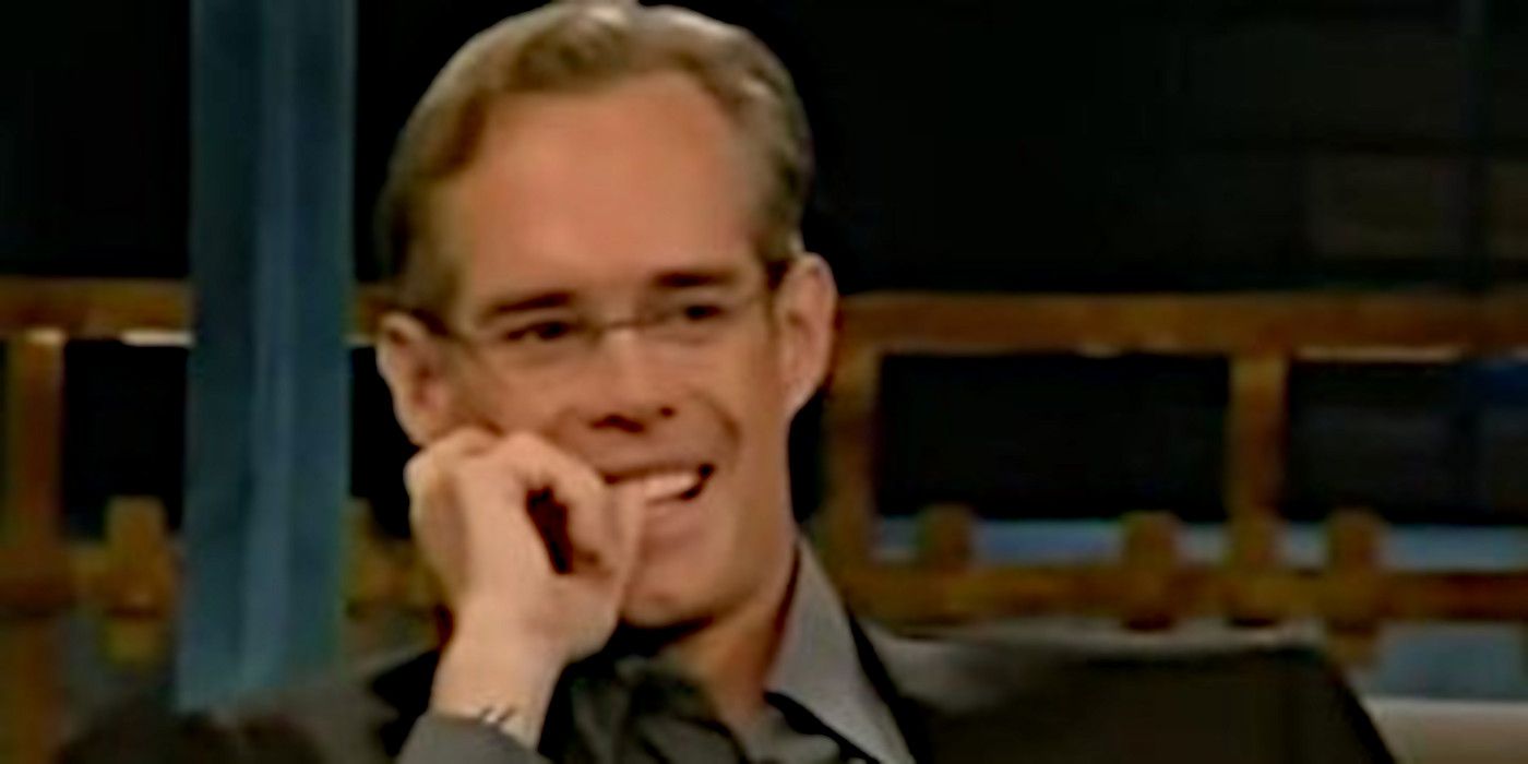 Host Joe Buck smiles with his hand on his mouth on 'Joe Buck Live.'