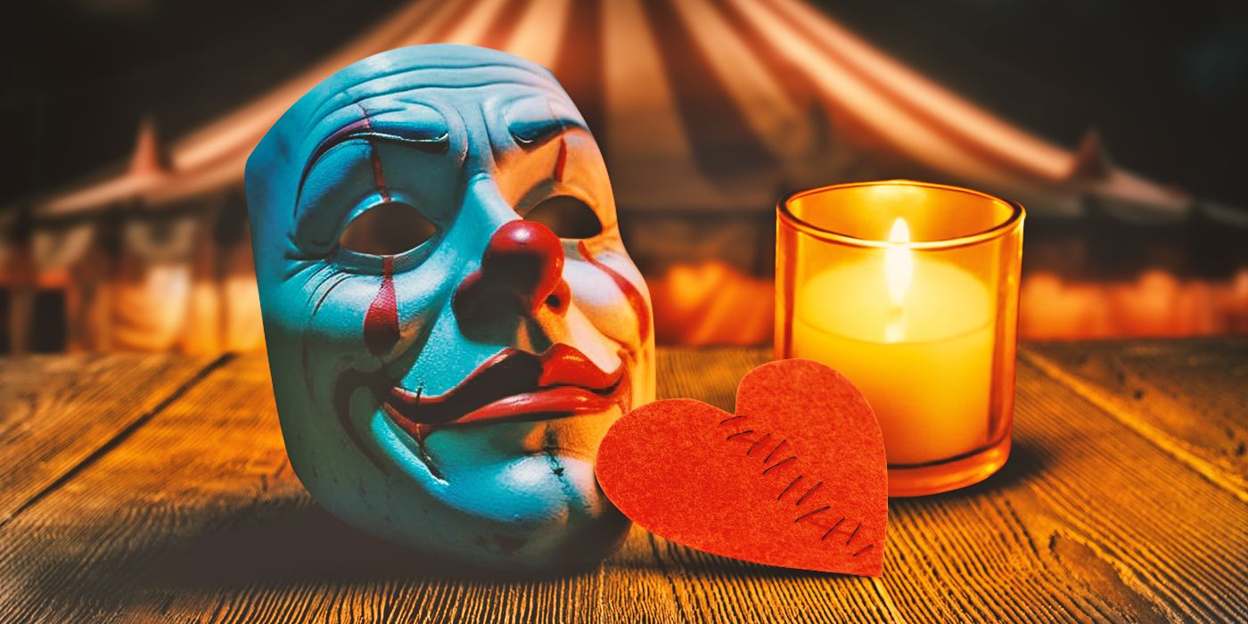 Imagen personalizada de máscara de payaso, corazón de papel y vela encendida sobre mesa de madera